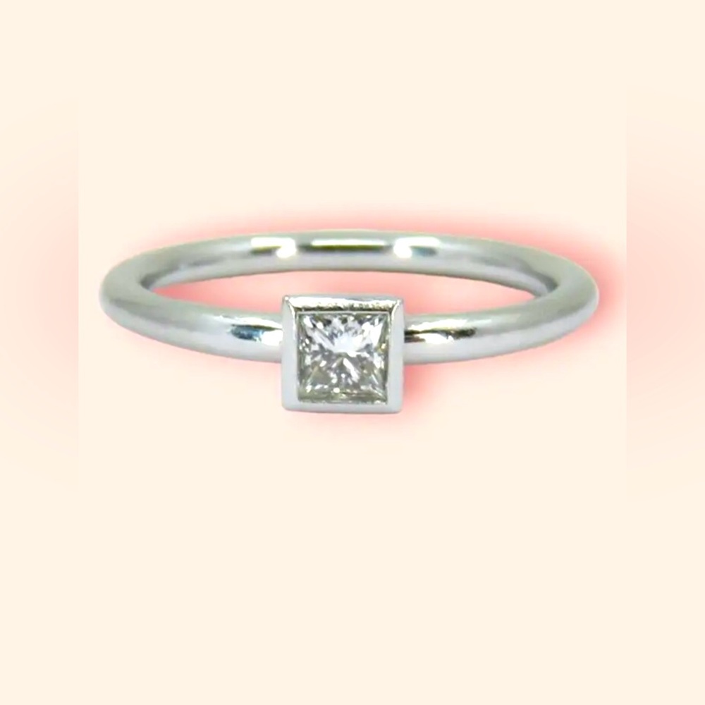 Tiffany & Co. Platinum and Princess Diamond “Bezet” Solitaire Ring